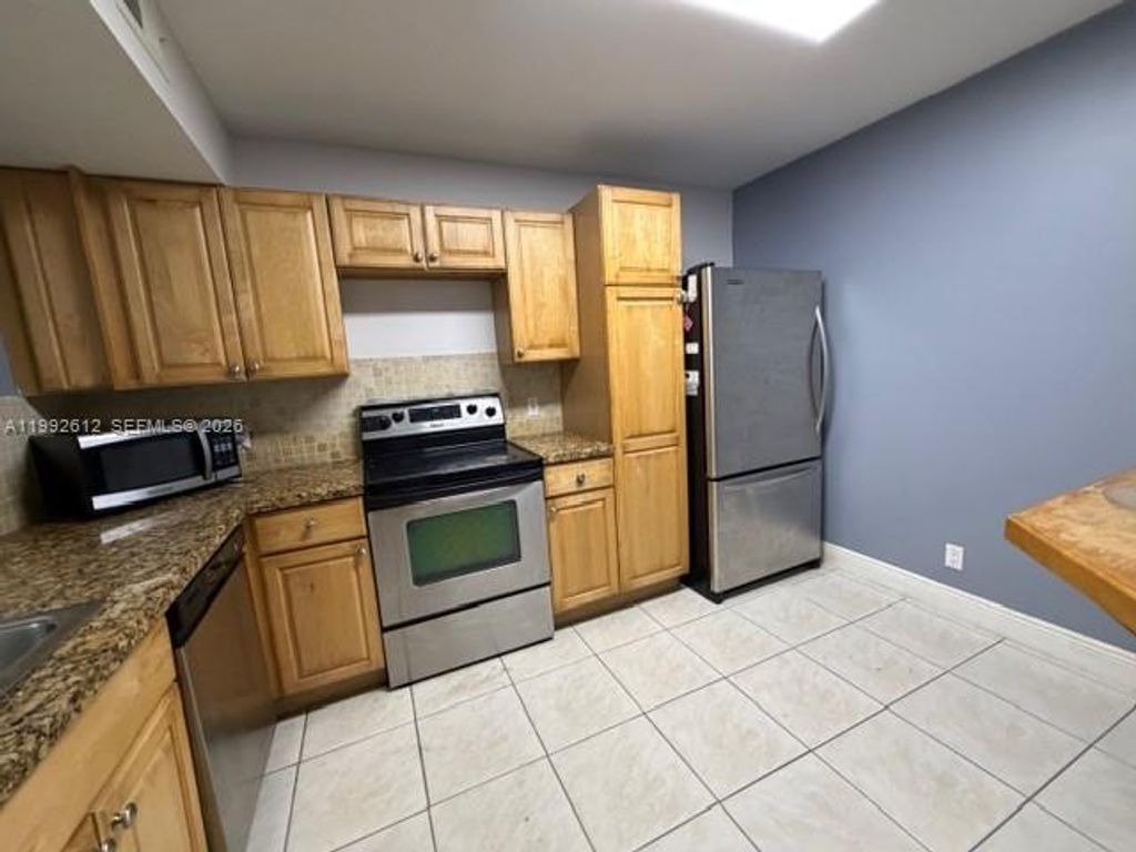 Photo of 8901 Wiles Rd #103, Coral Springs, FL 33067 (MLS # A11992612)