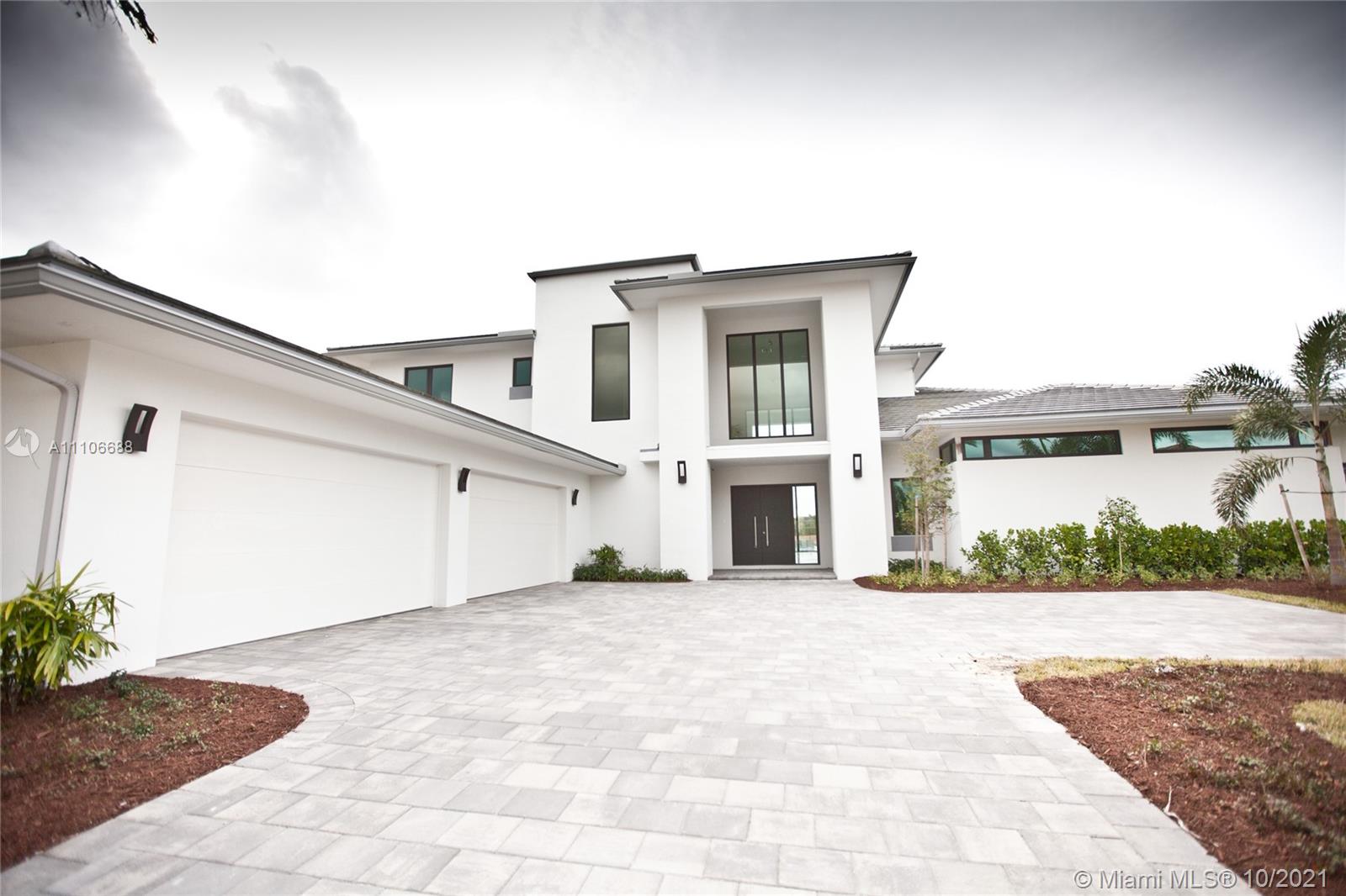 New custom home built in 2018, this beautiful home was built with family in mind, located in one of Weston's most sought-after communities. This elegant two-story canal-front estate features a beautiful open-plan kitchen with granite countertops, an oversized island, two sinks, fully stocked with top-of-the-line appliances, and a full butler's pantry. Master suite with private his and hers baths, walk-in closet and custom walk-in closets. Tile floors throughout. Large covered lanai, overlooking the pool and canal. Located on a 0.6467 acre lot, 4 car garage, 2 guest parking, hurricane impact glass, 7 bedrooms, 8 1/2 baths. All rooms include a private bathroom. 1 office and incredible infinity pool with heated SPA and incredible entertainment areas.