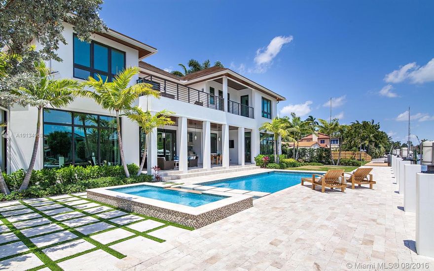 Sophisticated & chic newly constructed waterfront home! Spacious floor plan features spectacular kitchen with state of the art appliances & formal dining area with butler’s pantry. This spectacularly furnished home is great for entertaining with formal living area plus bonus club room flowing out to a gorgeous tropical pool with summer kitchen. Elevator accessed generous bedrooms are en suite & feature sun swept balconies & gorgeous water views. Luxurious master features his & her private baths & closets.