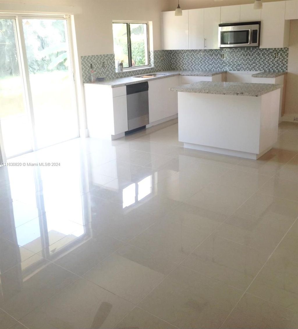 Photo of 720 NW 132nd Ter, Plantation, FL 33325 (MLS # A11630820)