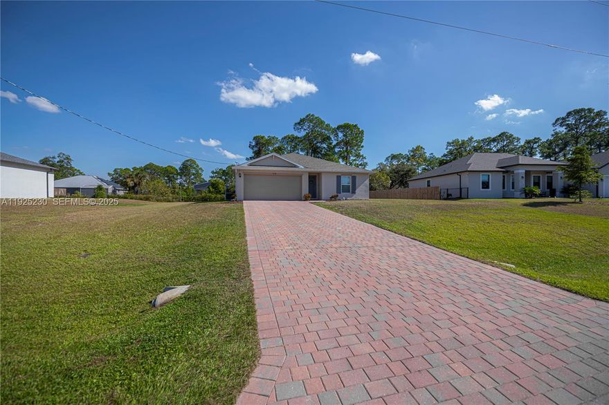 Take a look at this beautifully maintained home located in Port Labelle. This 4 bedroom, 2 bath home was build in 2023 and features concrete construction, impact resistant doors, and metal hurricane shutters for storm protection. The interior features tile flooring throughout the living areas with carpet flooring in the bedrooms. The kitchen features quartz counter tops and stainless steel appliances. There is an alarm system with cameras for added security. Enjoy your evenings relaxing on the back lanai or siting next to the fire pit on a cold night. This is a must see home!