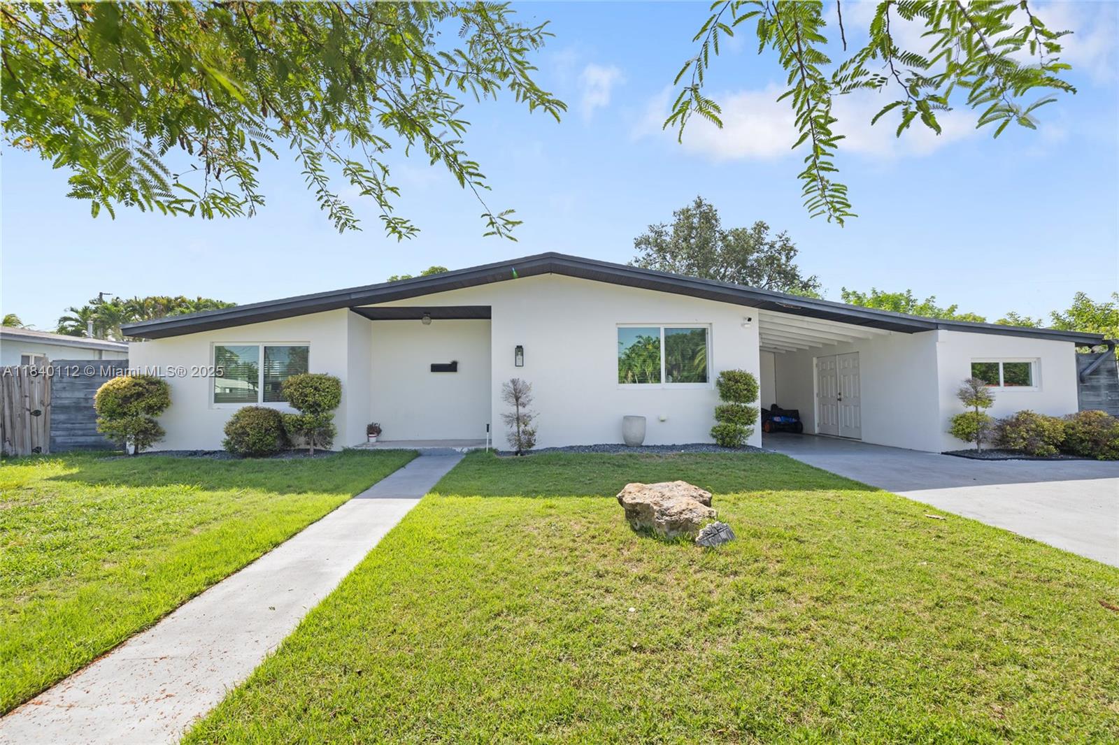 Beautifully updated 3-bedroom, 2-bath Cutler Bay classic with timeless charm and modern comfort. This 1,487 sq ft home features a remodeled kitchen, updated bathrooms, wood-look porcelain tiles, and hurricane impact windows and doors. Natural light pours into the open living spaces, creating a bright and inviting atmosphere.
Step outside to your own private oasis — a massive 40' x 29' in-ground pool, joined by a concrete tile patio with turf, and a stunning pergola—perfect for entertaining or relaxing year-round. The home also offers a carport and a 2-car driveway for ample parking. Located just outside of Whispering Pines, this is one of the most desirable neighborhoods in Cutler Bay, with easy access to parks, schools, and Black Point Marina. No HOA!