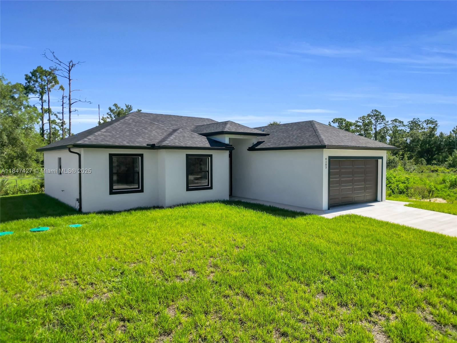 Seller is offering $10,000 in concessions toward buyer's closing costs and prepaid items! This stunning new construction in Lehigh Acres is filled with upgrades and thoughtful details. Underground electricity adds safety and $5,000 in value. Enjoy a decorative accent wall, screened lanai, and epoxy-coated garage floor. The home features 10-ft ceilings, 8-ft doors, impact windows, and sits on an elevated lot in a quiet neighborhood. The kitchen includes elegant countertops, premium cabinetry, and appliances to be installed before closing. Bathrooms are finished with glass shower doors, custom mirrors, and modern fixtures. A water filtration system and advanced septic will also be installed before closing. TV is included with the sale, Don’t miss the opportunity to make it yours!