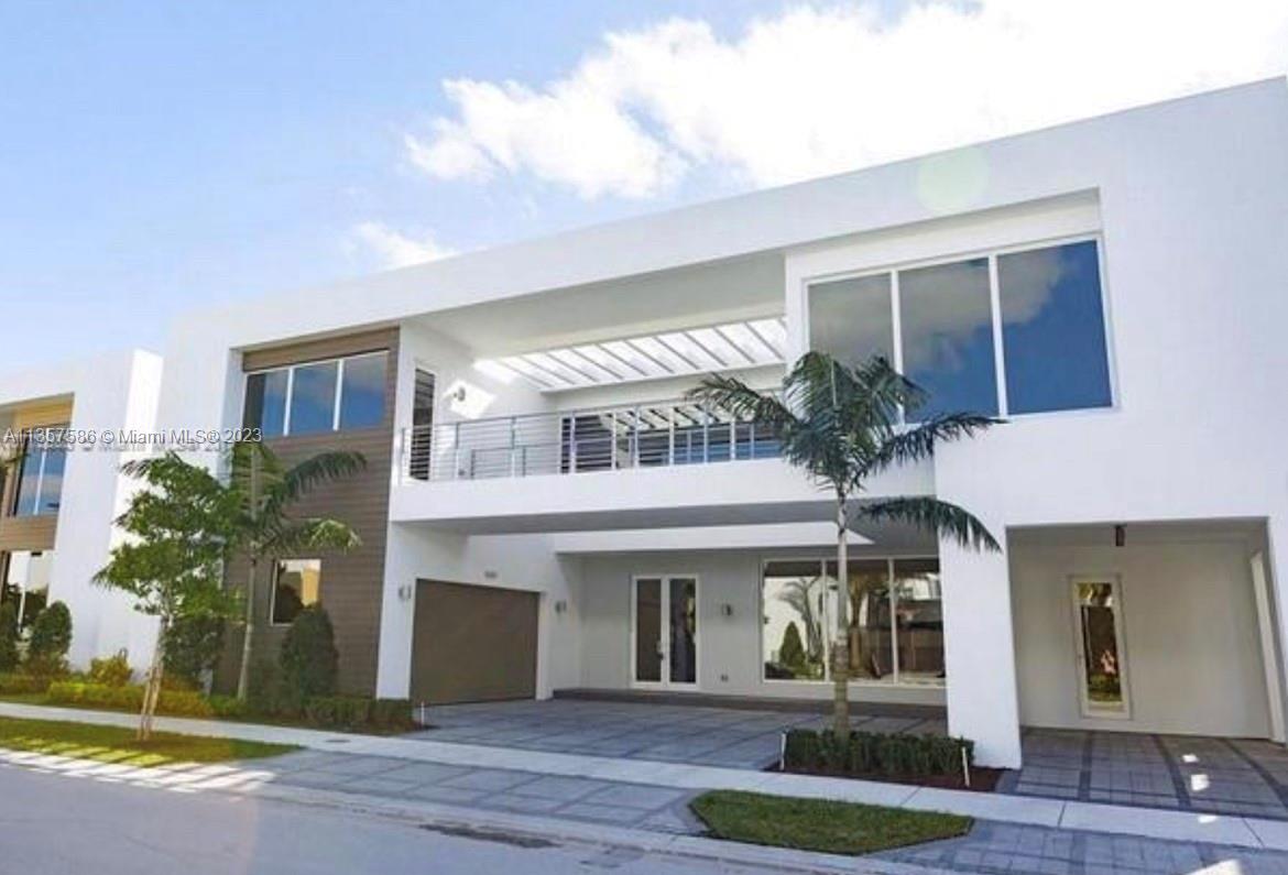 Luxury 6 bedroom & 7 bath home at Modern Doral 75. Gorgeous unit with 24 Ft. ceilings, top of the line Italian kitchen with quartz countertops & Viking SS appliances, wine cooler, impact windows & doors, two car garage and driveway. Stunning pool, built in grill, perfect for entertaining. Italian kitchen cabinets, white porcelain large tiles throughout. 1 bedroom with full bathroom on first floor. Each room with its own full bathroom. Exclusive clubhouse which serves as an extension of your home with a fully equipped & modern fitness center, children's playroom, sauna, business center with media room & kitchenette, spa & more.