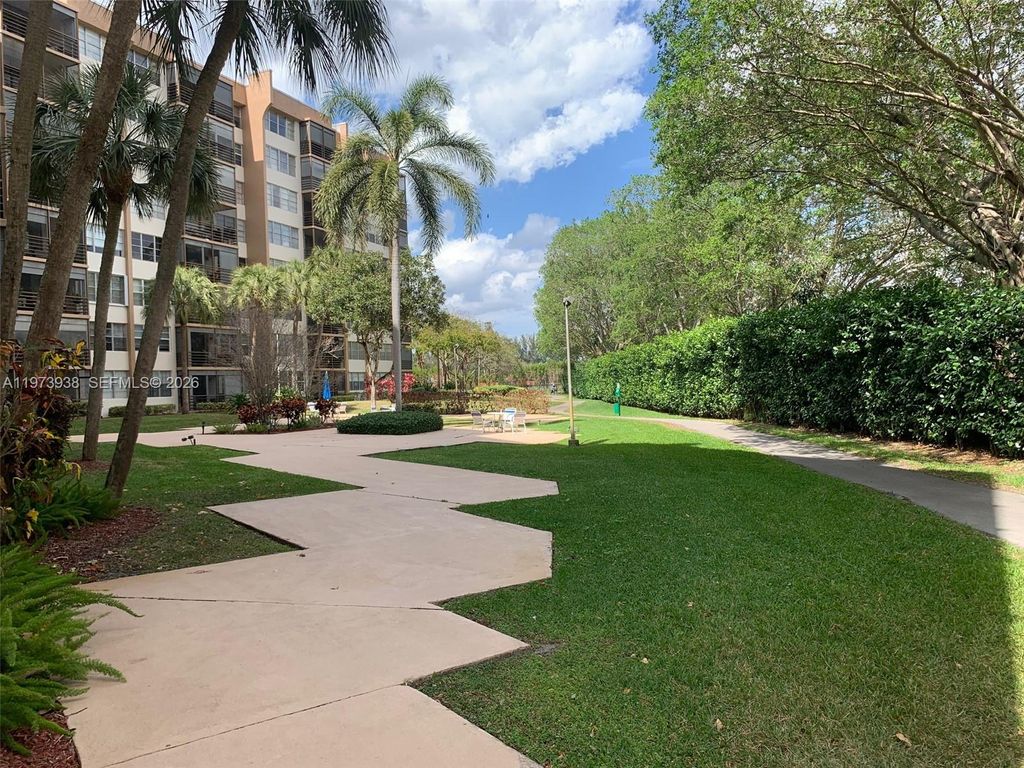 Photo of 1400 Saint Charles Pl #313, Pembroke Pines, FL 33026 (MLS # A11973938)