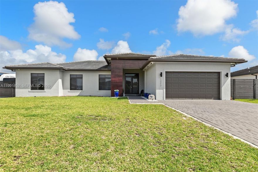 Fantastic 5 bed / 4 bath home, built in 2022, perfectly located between Kendall and the Keys.  Impact windows and doors provide storm protection and energy efficiency, helping keep the home comfortable year-round. Inside, you’ll love the open kitchen featuring quartz countertops, stainless steel appliances, and space for a full dining table, perfect for entertaining. Porcelain tile flows throughout the home.

The primary suite includes a soaking tub, a huge walk-in shower, and custom-built closets. Four additional bedrooms and 3 baths offer flexible living spaces for family, guests or a home office.

Outdoor living shines here: an oversized saltwater pool with a pergola, a built-in outdoor kitchen, and a fire pit—ideal for year-round entertaining and relaxation. The property also features a side parking pad with room for a boat or RV, plus a 30-amp plug. A two-car garage provides secure parking and extra storage, with generous driveway parking for guests.

From the modern finishes to the smart layout and top-tier amenities, this home is ready for you to move in and enjoy the Florida lifestyle.