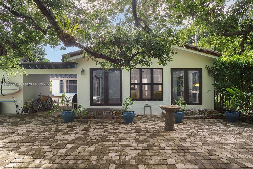 BEAUTIFUL 1924 MIAMI SHORES MEDDITERRIAN REVIVAL HOME.  LARGE LOT WITH MATURE LANDSCAPING, COVERED ENTERTAINING AREAS, HEATED POOL/SPA AND BIG PATIO.....VERY PRIVATE AND TRANQUIL.  3 BEDROOMS AND 2 FULL BATHROOMS.  THE OWNER'S SUITE CONSISTS OF A BEDROOM WITH A FIREPLACE, A LARGE WALK-IN CLOSET, (10 X 10) AND A SPA-LIKE BATHROOM WITH TWO SINKS AND A SHOWER PLUS A SOAKING TUB. THE  LIVING SPACES HAVE HIGH CEILINGS WITH LARGE IMPACT WINDOWS OVERLOOKING THE GARDENS AND POOL.  THIS HOME GETS A LOT OF NATURAL LIGHT.  BIG DINING AREA IS OPEN TO THE UPDATED KITCHEN WHICH IS OPEN TO THE ENORMOUS GREAT ROOM.  WALKING DISTANCE TO CAFES, COFFEE SHOPS, STORES, THE LIBRARY AND MORE.