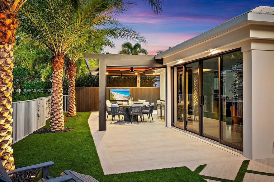 Fully renovated and thoughtfully re-designed, this exceptional cottage offers a rare blend of sophisticated design and effortless indoor-outdoor living. High-end finishes, sleek clean lines, and a bright open floor plan create a modern yet inviting atmosphere throughout the home. Expansive impact glass windows and doors fill the interiors with natural light while seamlessly connecting the living spaces to the outdoors. The redesigned layout maximizes flow and functionality—creating a one-of-a-kind cottage floor plan unlike any other in the community. Step outside to a backyard that rivals homes twice its size. Designed for both relaxation and entertaining, the outdoor space features multiple lounge areas, an impressive summer kitchen, and thoughtfully designed entertainment spaces.

A striking louvered aluminum pergola provides adjustable shade and architectural style, creating the perfect setting for gatherings day or night. Ideally located just moments from the Club, Tennis, Spa, and Marina, this truly special residence offers the perfect combination of luxury, comfort, and convenience in a beautifully reimagined cottage setting.