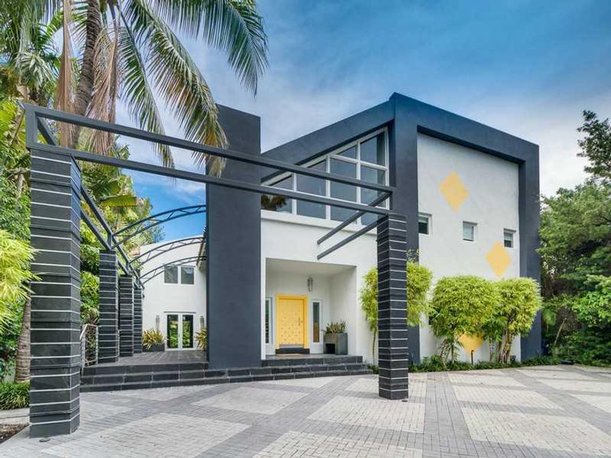 Beautiful Modern Turn-Key Waterfront home located on highly desired and gated Sunset Island 3. Plenty of living area, 7140 sf, open and bright floor plan. 5 bdr, 7.5 bths. Formal living and dining room. Huge master suite. Patio features green space, pool,  and privacy. 75' of water frontage with dock. Home has been designer furnished and is perfect for entertaining. Near shops, and restaurants.