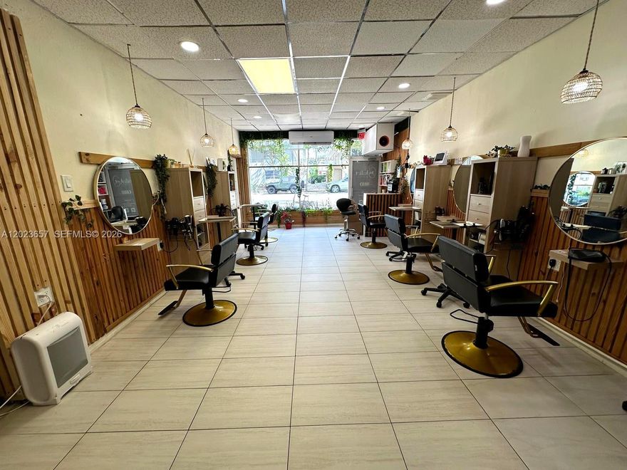 Rare opportunity to acquire a beautifully designed turnkey salon & wellness business located on high-traffic Normandy Dr in the heart of Miami Beach. This fully operational boutique beauty destination generates approximately $50,000/month in gross revenue through multiple income streams including hair services, manicure/pedicure services, laser hair removal, esthetics, and retail product sales. Buy today and start generating income immediately with an established operation already in place.

The elegant tropical-inspired interior features approximately 1,350 SF with 6 modern styling stations, 3 luxury shampoo stations, pedicure spa area, manicure stations, 2 private treatment/spa rooms, reception/lounge area, retail display space, storage, designer lighting, greenery accents, and upscale finishes throughout. The unique boutique ambiance creates a true Miami Beach luxury wellness experience.

Sale includes furniture, fixtures, equipment, existing buildout, established clientele, branding assets, and Instagram account with approximately 10,000 followers. Excellent storefront exposure with strong walkability, rear employee parking, tandem parking potential, and additional street parking in front.

Business operates with all required licenses and permits including salon license, Miami Beach Business Tax Receipt, and applicable operational permits. Approximately 2 years remaining on current lease with options available. Potential opportunity for E-2 Visa qualifying buyer.