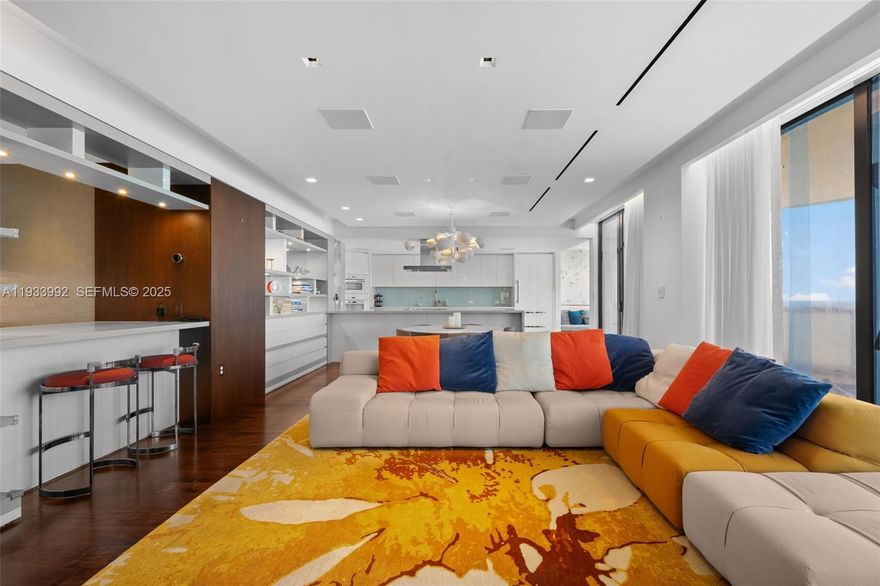 Experience refined luxury in this updated 3,230 sq ft flow-through 3-bedroom, 3.5-bath residence offering the best of both worlds—unobstructed direct ocean views and sweeping Intracoastal/city vistas. Accessed via private elevator, this rare floor plan features three ensuite bedrooms and an open-concept kitchen, dining alcove, living area with bar, all facing the ocean. Designed by STA Architectural Group, the residence showcases custom modern built-ins, high-end porcelain & engineered wood floors, and elegant marble finishes. Smart-home technology by Crestron, with Miele and Sub-Zero appliances, completes the home. The grand primary suite features a spa-like bath with double shower, steam, and a walk-in closet. Additional highlights of the unit include a utility room and extra storage room. Unit is offered furnished, AS -IS. Beachfront building is located steps from the world-renowned Bal Harbour Shops and Harding District, and within walking distance to houses of worship. Enjoy the amenities including spa services, private restaurant, valet, 24-hour security, pool and beach service, tennis courts, and more. Building exterior is under renovations. Balconies for this unit are expected to be re-open in April 2026.