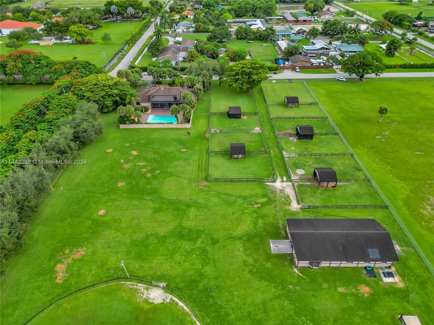 This outstanding equestrian property sits on a sprawling 4.38 Acre lot. It's well-designed barn w/7 stalls & air-conditioned office, 10 grass paddocks, large riding ring & ample pasture for grazing make this the perfect haven for you & your equine companions. The spacious home boasts 5,165 sq ft. w/unique spaces thoughtfully built to create an inviting atmosphere. The grand formal room w/bar & fireplace provide a sophisticated ambiance. The covered patio opens to an expansive pool deck providing space for outdoor relaxation. Every aspect of this residence speaks to the passion and dedication of its one and only original owners, their thoughtful design choices make this home an exceptional canvas for your unique touch. Agricultural tax exemption and income producing opportunity available!