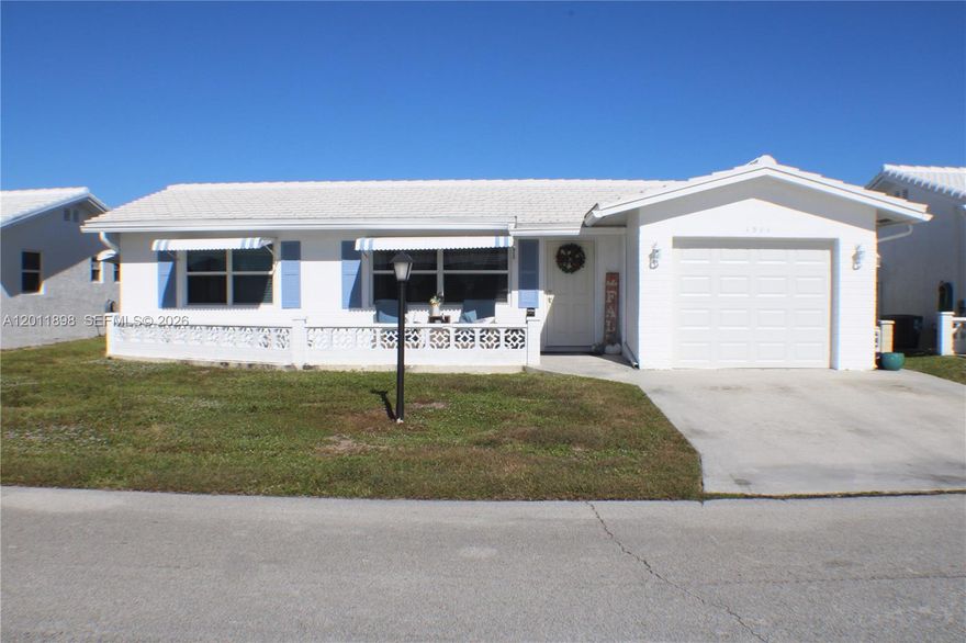 Beautifully maintained 2-bedroom home located in a quiet, well-kept community. This property features impact doors and windows throughout, recessed lighting, and an updated kitchen and bathroom. The home offers newer tile flooring, spacious living areas, and an additional flex space ideal for relaxing or extra comfort. The kitchen is equipped with newer appliances, and the home includes a new washer and dryer. The property has new duck work for the A/C system. All work including the roof is three years old. Move-in ready and perfect for comfortable living. Don't miss this opportunity.