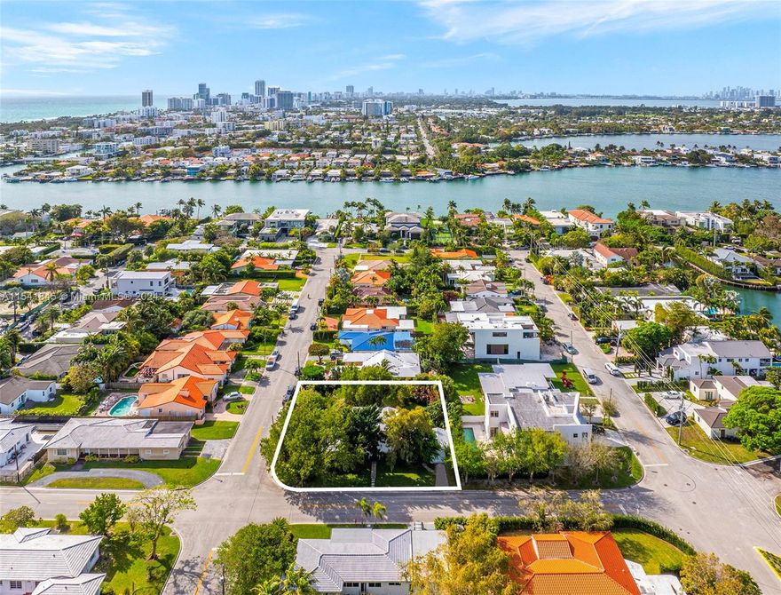 Introducing an exceptional opportunity to own a charming house on a desirable double corner lot in the coveted community of Surfside. Situated just one block away from the water and a few blocks from the beach, offering the perfect blend of coastal living and urban convenience. Boasting beautiful trees and ample space, this property exudes potential for those seeking to create their dream home in a prime location. Whether you envision a cozy retreat or a stylish modern abode, the possibilities are endless. Don't miss out on the chance to make this gem your own. With its prime location, charming appeal, and abundant potential, this property is truly a rare find. Schedule a viewing today and seize the opportunity to craft your ideal coastal lifestyle in this sought-after neighborhood.