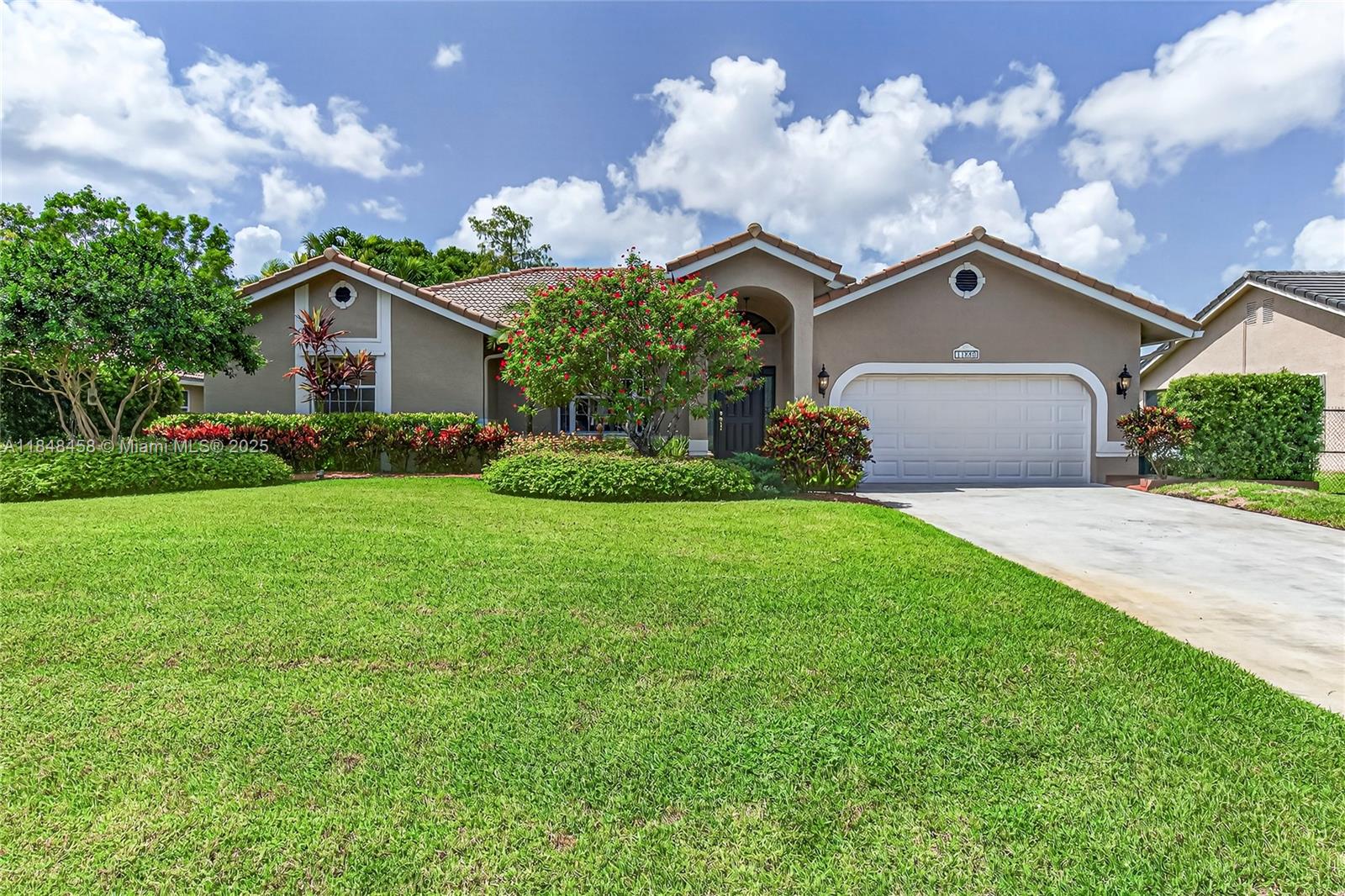 Welcome to your dream home in Plantation Acres! This stunning 4-bedroom, 2.5-bath pool home features a modern layout with a newly painted interior and exterior, as well as wood porcelain tile. It offers an updated kitchen with KitchenAid appliances, designer cabinetry, and elegant quartz countertops. Enjoy the home's split floor plan, which is perfect for privacy. Step outside to your lushly landscaped, fenced backyard, ideal for outdoor gatherings. The paved patio and screened enclosure offer a fantastic space for entertaining, with stunning views of the newly developed North Acre Park. Additional highlights include complete hurricane protection, a generous 1/4-acre lot with no HOA, and proximity to the Equestrian Center, FLL airport, Beaches, schools, and all major highways.