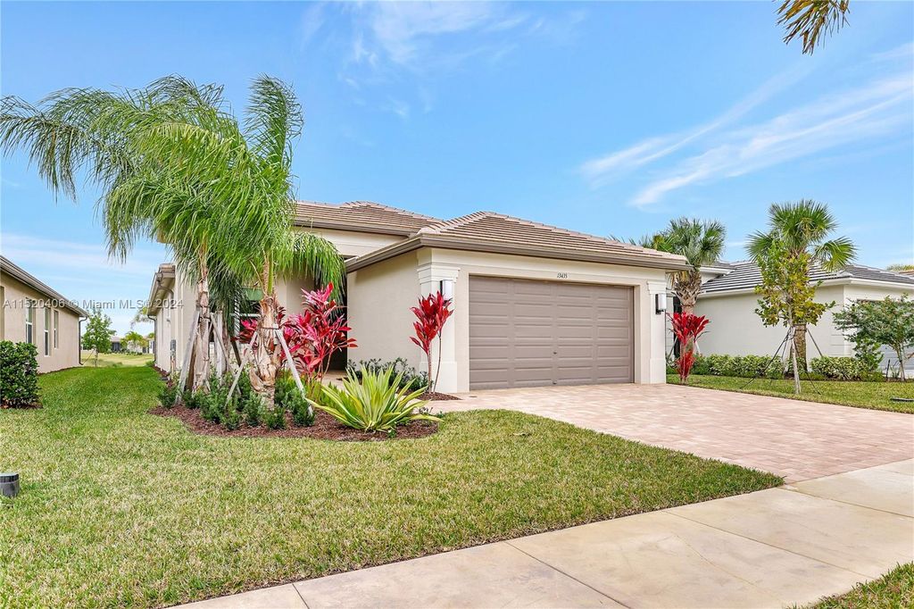 Photo of 13435 SW River Rock Rd, Port Saint Lucie, FL 34987 (MLS # A11520406)