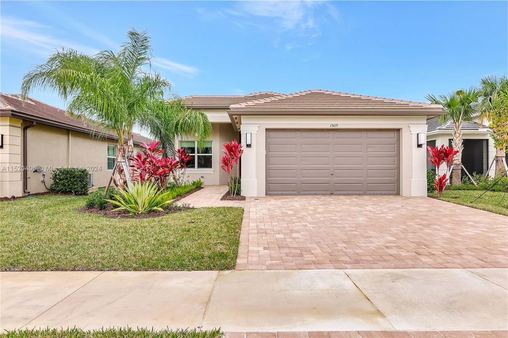 Photo of 13435 SW River Rock Rd, Port Saint Lucie, FL 34987 (MLS # A11520406)