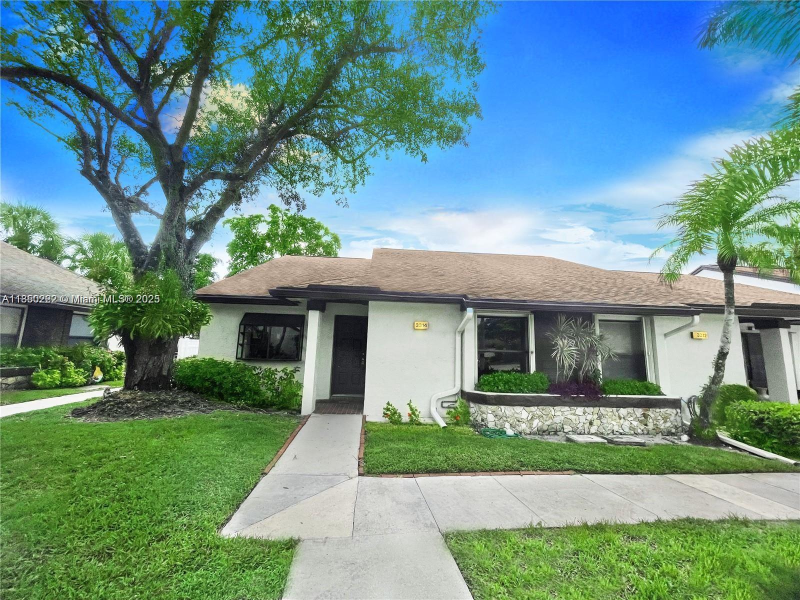 Just renovated Waterfront 2 bedroom, 2 bath townhouse w/sunny Florida room located in the desirable Ginger Tree Village in Coconut Creek. Spacious open floor plan with plenty of natural light overlooking a serene lake. New laminate wood floors, kitchen cabinets, granite countertops throughout, stainless steel appliances, new bathroom vanities & new sinks / faucets, new lighting throughout, new paint, new closets, full size washer / dryer & laundry room. The master bedroom boasts a walk-in closet and en-suite bathroom. Lots of storage, fantastic neighbors, clean, well kept community with pool, clubhouse, and tennis courts. HOA is 1670 quarterly