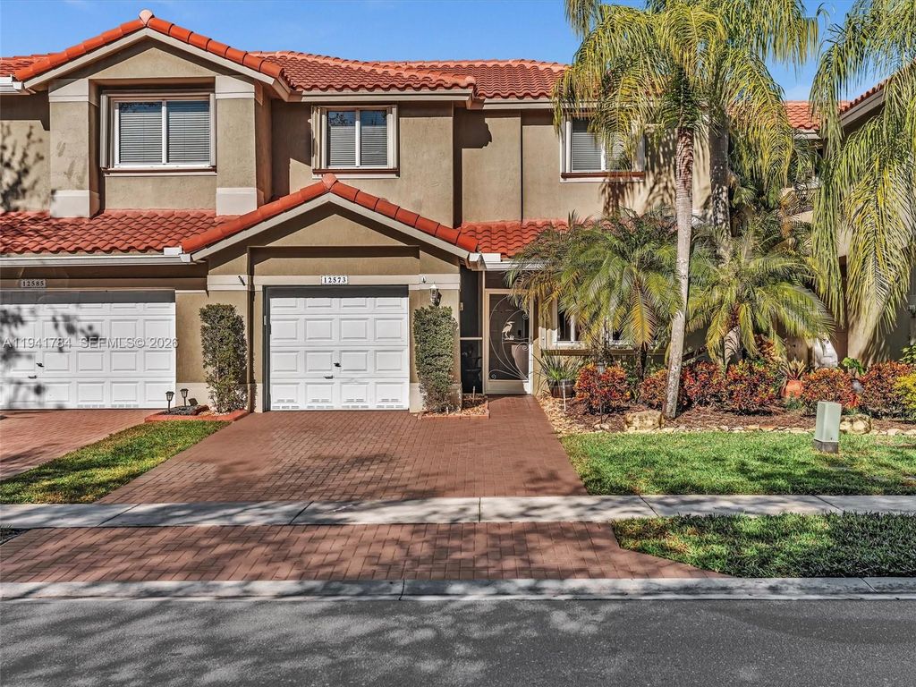 Photo of 12573 NW 56th Dr, Coral Springs, FL 33076 (MLS # A11941784)