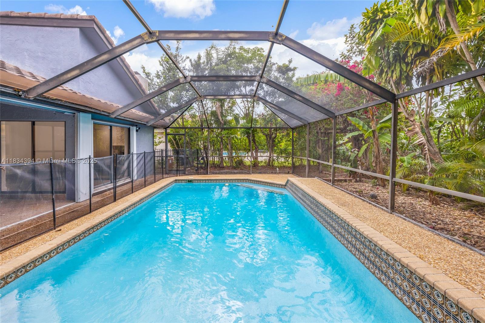 Step into your dream home! This stunning 4-bed, 3-bath pool residence sits on a rare, oversized corner lot in the sought-after Pine Ridge community. Completely renovated with a sleek new kitchen, modern bathrooms, and stylish tile flooring throughout. High vaulted ceilings and a smart split-bedroom layout offer space and privacy. Enjoy Florida living at its best with a huge screened-in patio, sparkling pool, and expansive backyard. Impact windows and doors, fresh paint inside and out, circular driveway, and 2-car garage complete the package. Low HOA, flood zone X, and minutes from top schools, dining, and shopping. Move right in and start living!