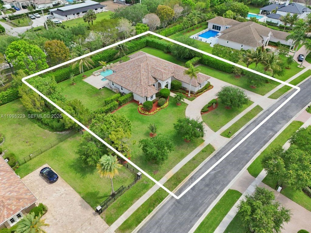 Photo of 14401 N Jockey Cir N, Davie, FL 33330 (MLS # A11995223)