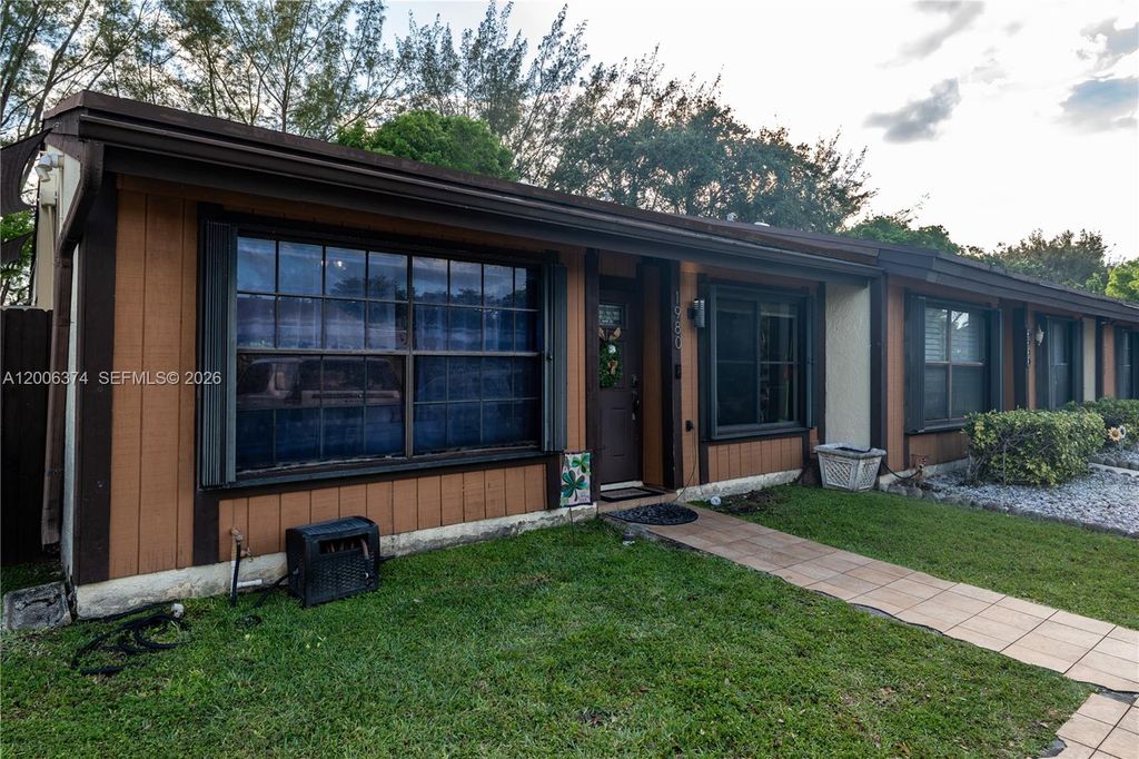 Photo of 1980 Seagrape Ave, Pembroke Pines, FL 33026 (MLS # A12006374)