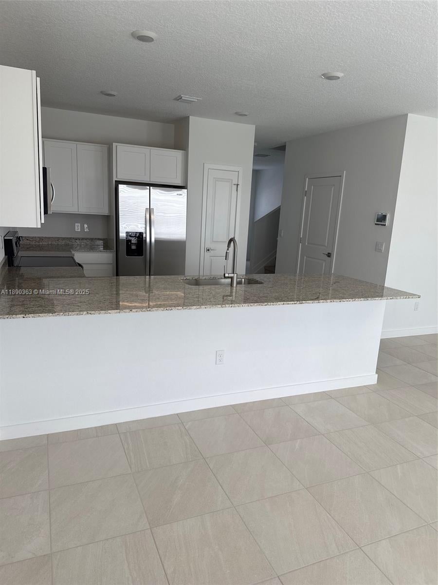 Photo of 5028 Elderberry St #5028, Haverhill, FL 33415 (MLS # A11890363)