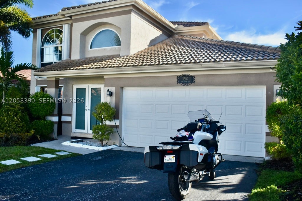 Photo of 1352 NW 129th Way, Sunrise, FL 33323 (MLS # A12058390)