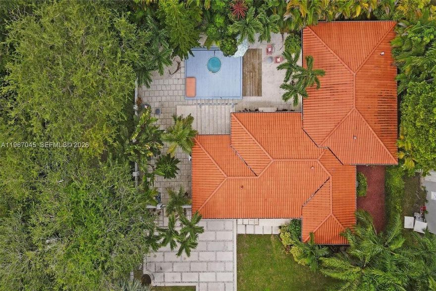 (HUGE DOUBLE CORNER LOT!) Over 125K Price Reduction & Over $100K in upgrades! Fully remodeled Coral Gables gem on a rare double lot and prime corner location. 4BR/2.5BA Mediterranean beauty with impact windows and doors, hardwood floors, and soaring ceilings. Expansive living and dining areas flow into a European kitchen featuring flat-panel cabinetry, quartz counters, wine cooler, and Dacor & Bosch appliances. Marble spa suite offers a frameless glass shower, soaking tub, and double vanity. Enjoy the oversized lanai with wet bar and pass-through to a tropical yard with pergola, deck, lush landscaping, pencil palms, room for a large pool, sprinkler system. One-car garage and ample parking. Minutes to Miracle Mile. Seller financing available—best DEAL in the neighborhood, check comps! Additional upgrades and features: Barrel tile roof updated 2019 with permits, copper plumbing, upgraded electrical panel (2010), dual-zone AC units (2010) serviced 2024, washer & dryer 2023/2024, Key West–style dipping pool/spa with equipment replaced 2023, full tenting completed March/April 2025 with active termite bait system, fully fenced privacy landscaping, oversized courtyard, garage storage loft, and stepping-stone driveway for multiple vehicles. Prime location near Biltmore & Granada Golf Courses, Venetian Pool, UM, and top-rated schools. On Zillow, scroll down to "facts & features", click on "show more", then click "View virtual tour" for your Virtual Interactive Lifestyle Concierge!