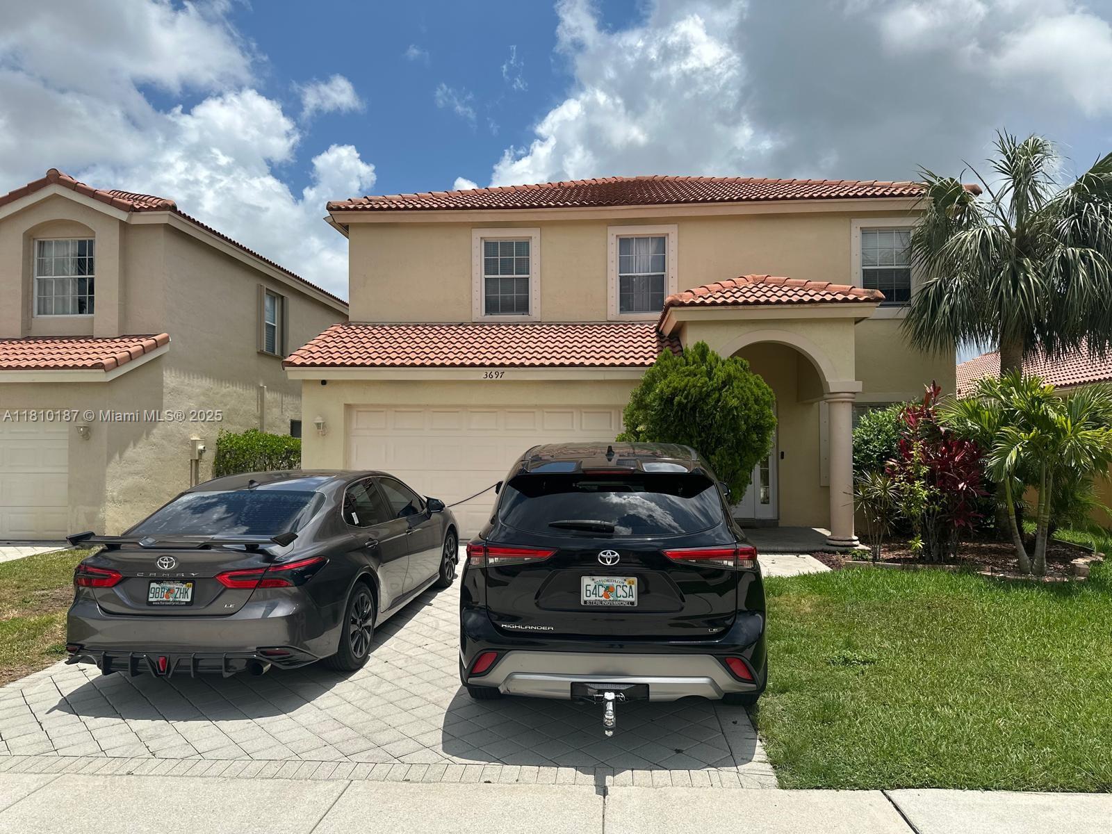 Beautiful lakefront single-family home in the sought-after Grand Isles community! This 4-bedroom, 2.5-bath home offers over 2,100 sq ft of living space with serene water views. Features include a spacious kitchen, open living areas, and a two-car garage. Enjoy a peaceful backyard with lake frontage, perfect for relaxing or entertaining. Grand Isles is a gated community with resort-style amenities: pool, tennis courts, fitness center, and clubhouse. Zoned for top-rated Wellington schools!