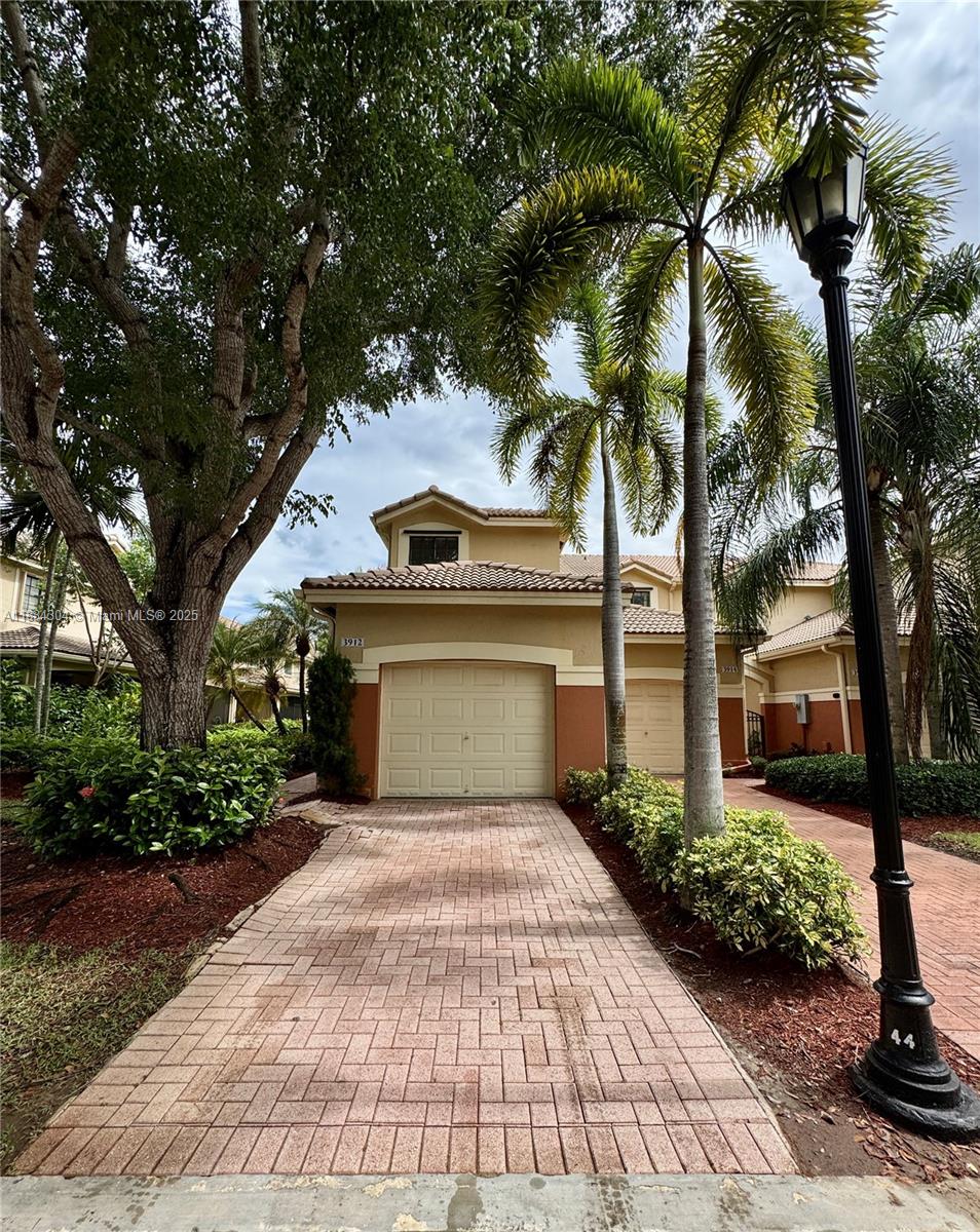 Beautiful corner townhouse in Courtyards at The Grove in Weston, featuring 3 bedrooms, 2.5 bathrooms, an attached 1-car garage, and a driveway that fits an additional vehicle. Bright and spacious with laminate wood flooring throughout living areas and bedrooms, and tile in the kitchen with Corian countertops and neutral finishes. Enjoy a covered back patio with lush landscaping. Located in a gated community with security patrol, pool, and playground for kids. Conveniently close to A-rated schools, parks, and the Weston Library. Excellent location with easy access to shopping, dining, and highways. A must-see rental in one of Weston’s most desirable communities!
