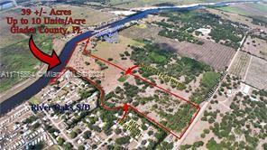ZONED & PERMITTED RV PARK PROJECT IN ENTERPRISE/OPPORTUNITY ZONE OF GLADES COUNTY, FL. OPPORTUNITY FOR THE SAVVY INVESTOR! Fully zoned RV park project with entitlements and permitting already in place INCLUDING UTILITIES! This 39 +/- acre pristine site is nestled along the serene shores of the Caloosahatchee River, a part of the Intercoastal Waterway, in the secluded Ortona area of Glades County, Florida, with developer incentives available for your project. This tropical native site is designed and permitted for an RV park project, or, by modifying the current plan, entrepreneurs with a vision could develop “glam-tent living”, tiny houses, rustic cabins, “RVominiums”, protected boat storage or other possibilities! DEVELOP YOUR DREAM RV PARK PROJECT! SEIZE THE OPPORTUNITY!