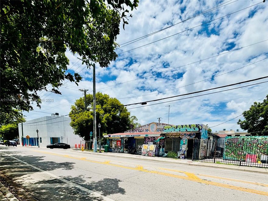 Investment Opportunity in Red-Hot Wynwood North! This dual-address corner lot (203 NW 35 St & 3510 NW 2nd Ave) sits steps from MidTown, offering prime development or income-producing potential. Zoned T5-O, this 5,000 SF lot currently features a 1,590 SF structure divided into two legal units. The front commercial unit is rented NNN for $4,000 per month, while the vacant 3/2 rear unit can be rented for $3,500 per month or generate up to $10,000 per month on Airbnb. Corner exposure offers unbeatable visibility and branding potential, and zoning allows for a mix of uses, including multifamily, retail, office, and short-term rentals. Whether you're looking for cash flow now, a redevelopment play, or a long-term land bank.