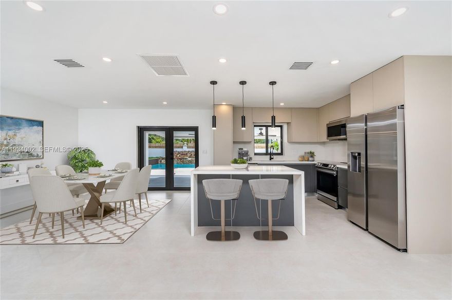 Beautifully fully remodeled single family home featuring a modern and contemporary design.   This stunning property offers 3 bedrooms and 2 bathrooms in the main house, bright and open living spaces, a modern kitchen with stainless steel appliances, modern updated bathrooms, garage, impact doors and windows.
The outdoor area is perfect for relaxing or entertaining with a beautiful pool and jacuzzi.
As a valuable extra, the home includes a separate in-law suite with its own living room, dining area and full kitchen, one bedroom and one bathroom, offering excellent flexibility for extended family, guests or potential rental income.
A true move-in ready gem combining style, comfort, and versatility!!