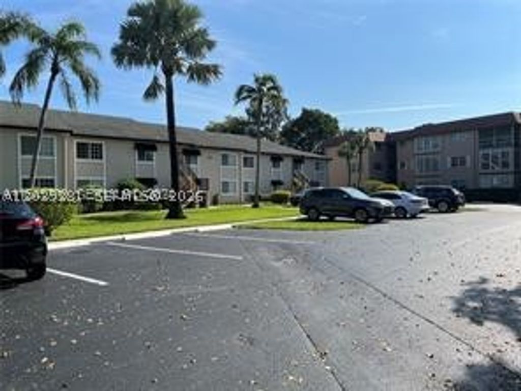 Photo of 4000 Crystal Lake Dr #111, Deerfield Beach, FL 33064 (MLS # A12039281)