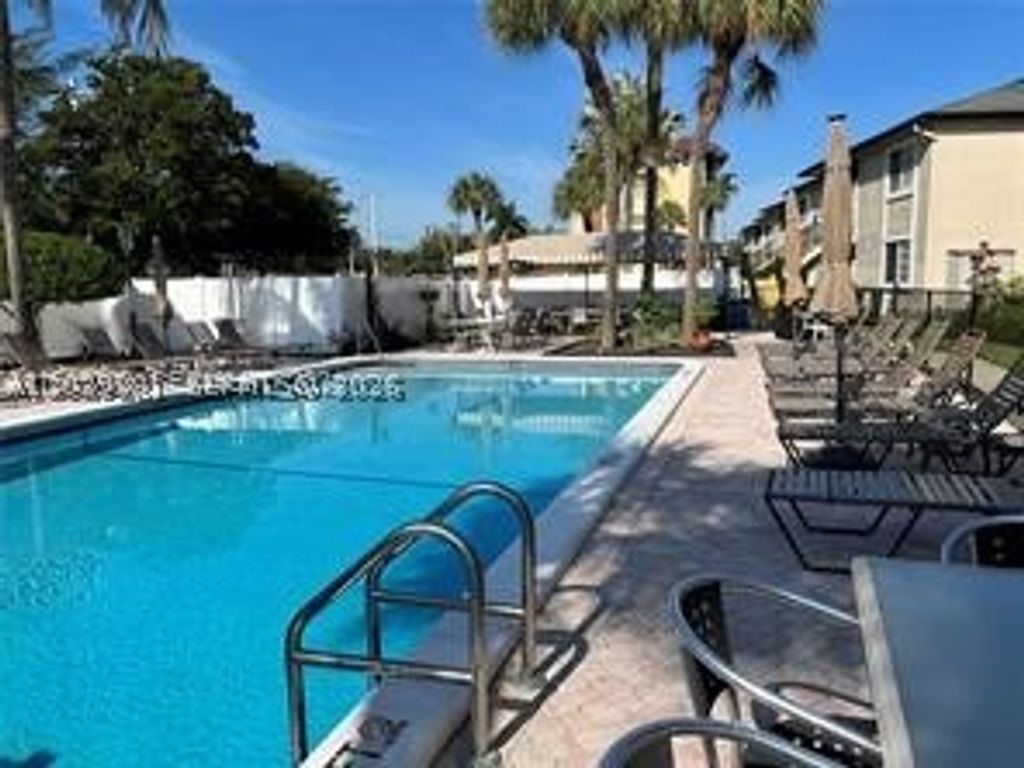 Photo of 4000 Crystal Lake Dr #111, Deerfield Beach, FL 33064 (MLS # A12039281)