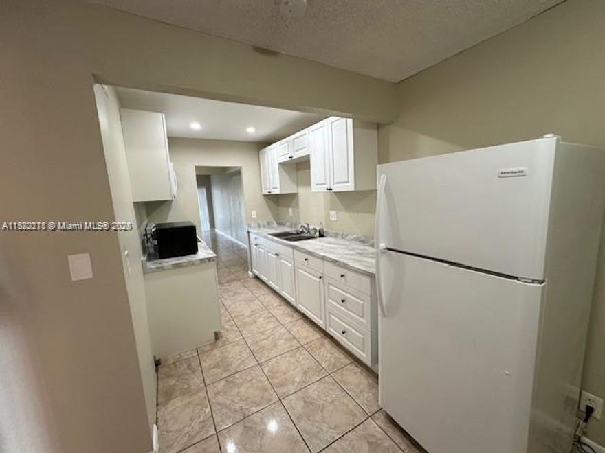 Wimbledon 3/2.5 Lake front townhome, Spacious layout, fresh paint, plenty of storage throughout, large garage, tile and wood laminate flooring, located right across from community pool!