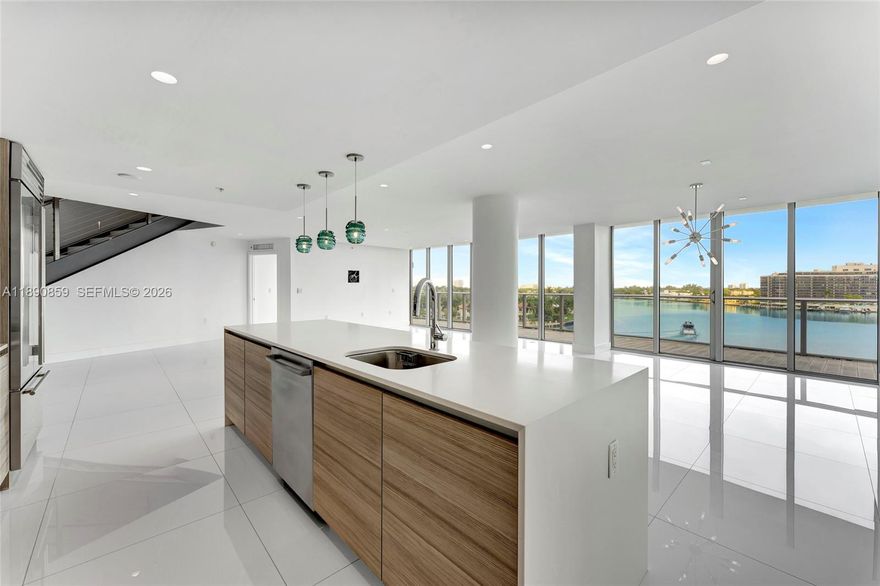 Experience ultimate luxury living at Peloro, a 7-story boutique condo on the serene bay front. This opulent 3-bedroom, 3.5-bathroom Penthouse boasts over $350K in upgrades, including bespoke designer fixtures and high-end appliances. Enjoy stunning west-facing views of the bay and city skyline through your floor to ceiling windows and from your private rooftop terrace, complete with a relaxing Jacuzzi and a full summer kitchen, making it perfect for entertaining guests. One of the standout features of this complex is its gym, which includes a sauna for ultimate relaxation. Other amenities include 24-hour concierge, waterfront pool, and covered parking. It is also located within walking distance to the beach, making it easy for guests to enjoy the sun, sand, and sea!