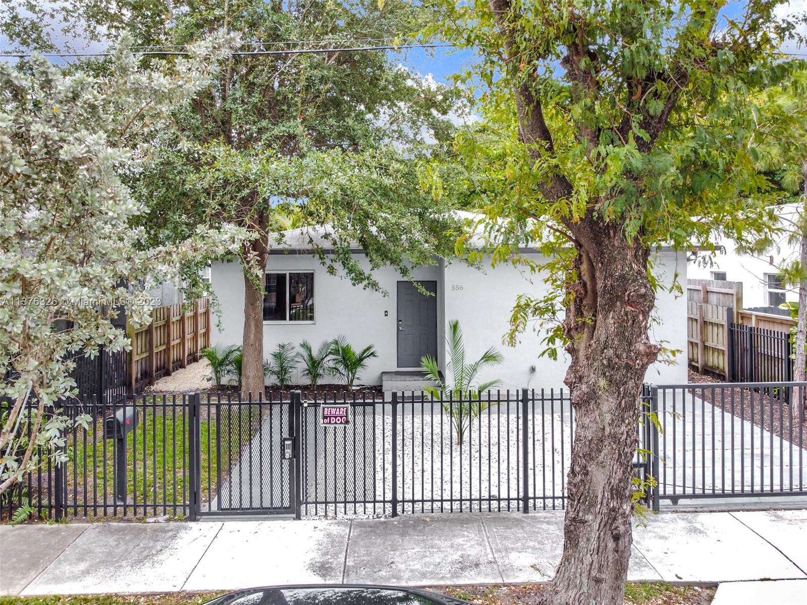 Welcome home! It is a beautiful 3/2 well-designed open-concept single family homes built in 2018. It features gated metal fence in the front, concrete Slab parking pavement, wood fence on both sides and back, Boat or RV access gate in the back and pool.