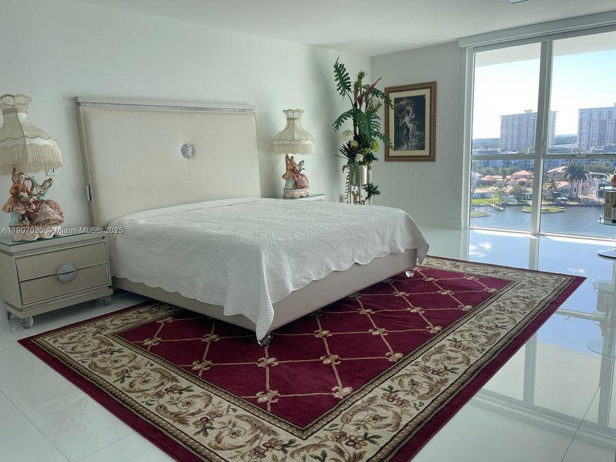 Step into a world luxury and elegance with this stunning 2-story condo offers million-dollar views of Intracoastal, Oleta River Park and Ocean. Boasting 1690 square feet of living space, residence features a unique master bedroom on the second floor, along with 2 bedrooms and 3 luxurious bathrooms. The modern kitchen is equipped for culinary excellence, while a large open balcony offers panoramic views, making it the perfect spot to enjoy the beauty of surroundings. Brand new electric blinds in the entire apartment. The resort style amenities are truly exceptional, offering an infinity lap pool, jacuzzi, a spa, fitness center, pool bar, steam room, meditation garden and a tennis court - all located on the 6th floor.