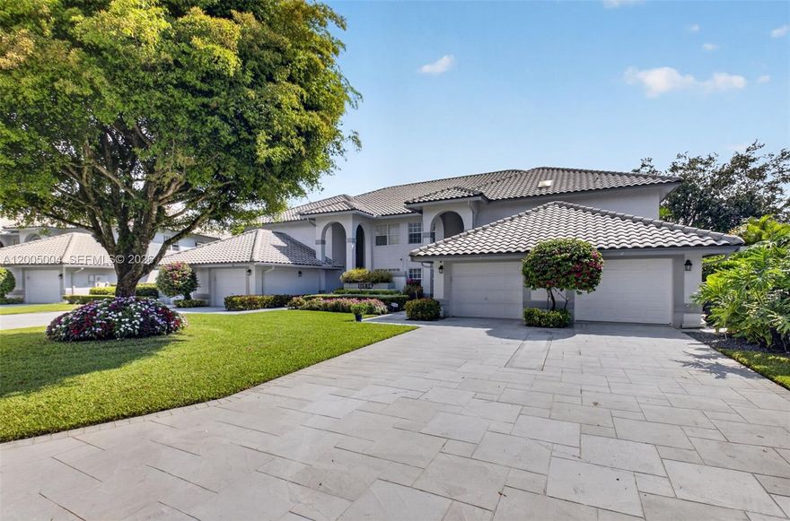 BEAUTIFULLY UPDATED GOLF & WATER VIEWS! Rare opportunity to own a move in ready spacious Penthouse unit residence w/ amazing views & nearly 2,000 sq feet of living space. Easy access up or downstairs with a private recently upgraded elevator. Bright & inviting condo w/ desirable split bedroom floor plan, generous living and dining areas, plus eat in kitchen and large windows showcasing tranquil golf course views & upgraded full sized washer / dryer & tons of storge everywhere. Both bathrooms beautifully upgraded w/ frameless shower door and separate large tub. Expansive primary suite w/ golf & water views, sitting area & custom walk-in closet. Attached private garage, ample storage, and a beautifully updated open concept kitchen w/ shaker style cabinets, quartz counters, tile backsplash, additional storage / buffet area & stainless appliances. Enjoy peaceful surroundings and scenic views from the main living areas while living in a well-maintained, gated community offering security and access to clubhouse amenities w/ additional optional membership. Incredibly spacious layout & opportunity to build an additional bedroom or office from the family room space, plus enclosed Florida Room for additional den / office space, amazing volume ceilings & custom wrought iron & wood banister makes you feel like you're in a luxury home. With tons of upgrades and desirable setting, this condo presents an exceptional opportunity for comfortable living. X Flood Zone!