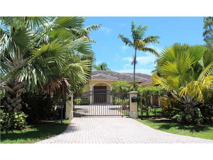 Beautifully kept pool home in Palmetto Bay with in ground gated pool, open column terrace, large formal living areas, decorator colors, crown molding, ceramic tile throughout. Updated spacious kitchen with breakfast counter.  Brand new washer/dryer. Must  see.