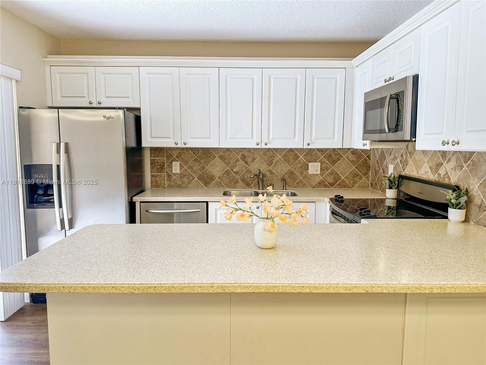 Welcome to this beautifully maintained 2-story townhouse located in Waterford Courtyards, right in the heart of Plantation’s vibrant Central Park. This home offers the perfect mix of comfort, space, and convenience. Enjoy partial lake views from the spacious primary bedroom, where soft natural light fills the room each morning. Generous closet space, a bright and open layout, and a functional floor plan. Step outside to your expansive private patio, perfect for BBQs, outdoor dining, or relaxing in the Florida sun. Hosting guests? No problem. This unit boasts the most guest parking spots in the area, making it very convenient for entertaining. Walk to nearby restaurants, grocery stores, and retail shops. Easy access to I-595, I-75, and the Sawgrass Expressway for a smooth commute.