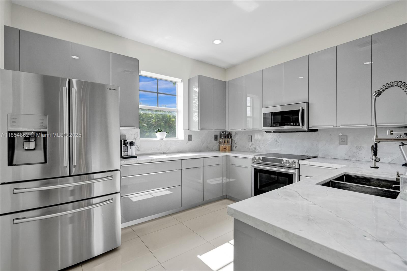 Magnificently Remodeled 3 story townhouse in East Fort Lauderdale! 3 bedroom, 3.5 bath, 2 car attached garage, gated, secure, & professionally managed complex seconds to Sunrise/A1A Beach Holiday Park & Galleria Mall. Complex is 2 minutes to Downtown & Las Olas. Townhouse features Ceramic & Wood Floors, Custom Kitchen w/ Granite Countertops, Wet Bar w/ Built-in Wine Cooler & Ice Maker, New Bathrooms w/ Jacuzzi Tub & Double Shower, Built-In Closets, LED lighting, Garage Storage, & much more! Perfect for roommates, investors, or small family! Large unit w/ lots of light, soaring ceilings, impact windows, & laundry room. Steps away from pool, guest parking, & grilling area! Walk/bike to beach, Publix, Whole Foods, Trader Joes, Gateway Theatre, & shopping! Location can't be beat! New Roof 2024
