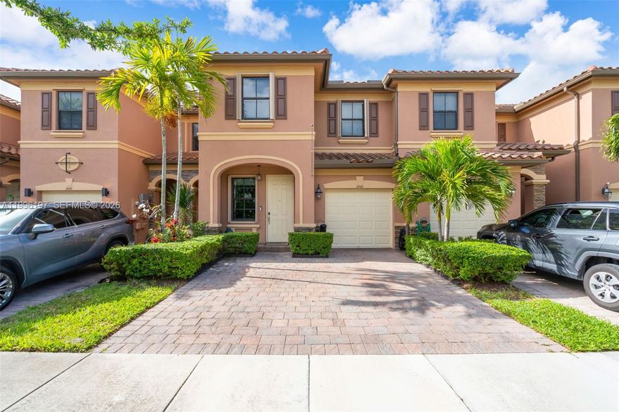 Move-in ready 2-story townhome in gated Bellagio— 3 bed, 3 bath, 1,910 sq ft. Bright, open layout with a modern kitchen, custom bar, and generous storage throughout. Ceramic tile and vinyl floors flow seamlessly into the family room. Convenient full bathroom on the first floor; all bedrooms upstairs. Private backyard and two assigned parking spaces plus guest parking. Resort-style community amenities include clubhouse, gym, pool, sports courts, playground and 24-hr security. Easy access to highways, shopping and dining — a stylish, comfortable home ready to enjoy.