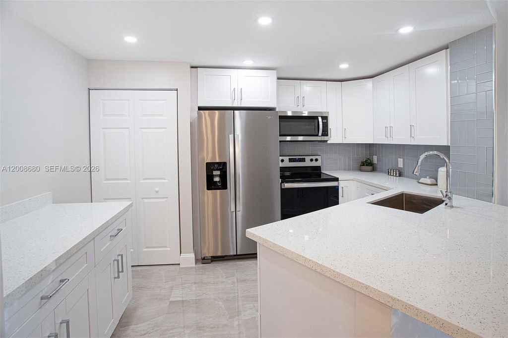 Photo of 7527 S Oriole Blvd #101, Delray Beach, FL 33446 (MLS # A12008680)