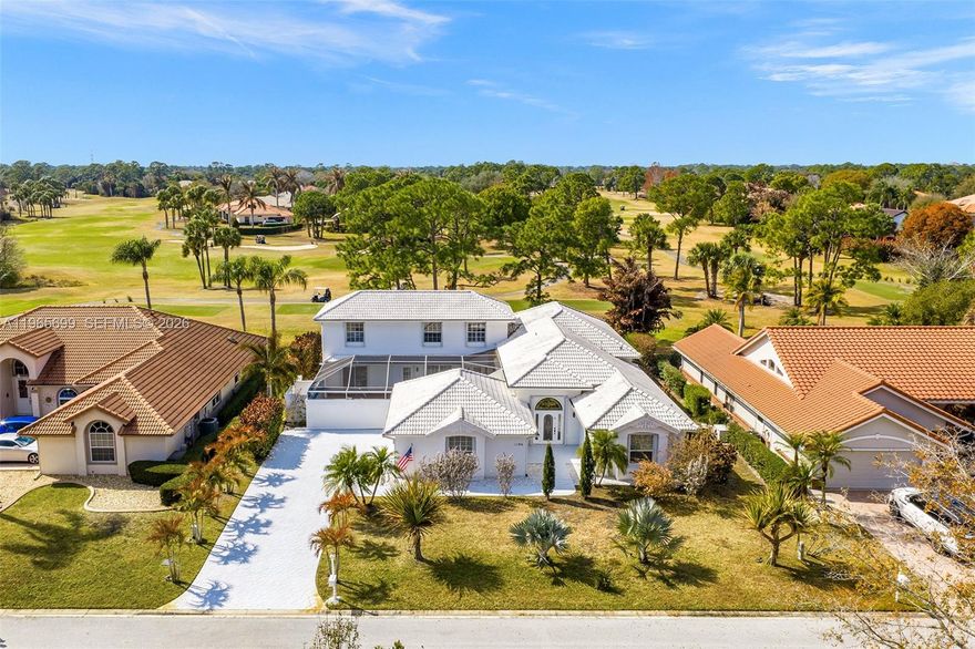 Beautiful 2 story courtyard pool home in the gated community of Country Club Estates perfectly positioned on the 12th tee of the Golf Course with sunrise and sunset views. This one-of-a-kind 4-bedroom, 3-bath home has an abundance of natural light, creating a bright, airy ambiance throughout with an open living space. Designed for seamless indoor-outdoor living, the screened courtyard with saltwater pool flows effortlessly through the main living area to a screened lanai showcasing golf course, lake and sunset views. Custom designed kitchen featuring a 10x5 ft island, a blend of granite, crystal and marble with custom built floor-to-ceiling cabinetry. The ground-floor primary suite and bath are privately situated in its own wing, separate from the guest bedroom and bath located on the opposite side of the home. Upstairs, two additional bedrooms and a full bath overlook both the golf course and courtyard pool. One of them features a screened balcony with beautiful views. Golf and Social Memberships are available but not required.