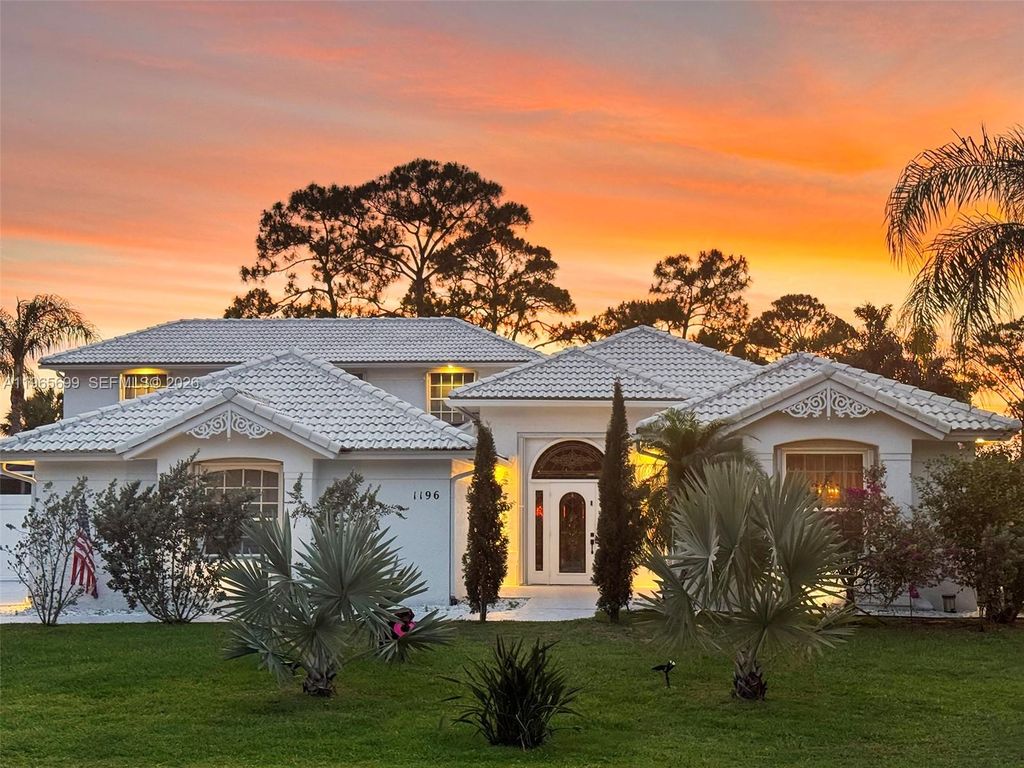 Photo of 1196 SW Live Oak Cv, Port St Lucie, FL 34986 (MLS # A11965699)