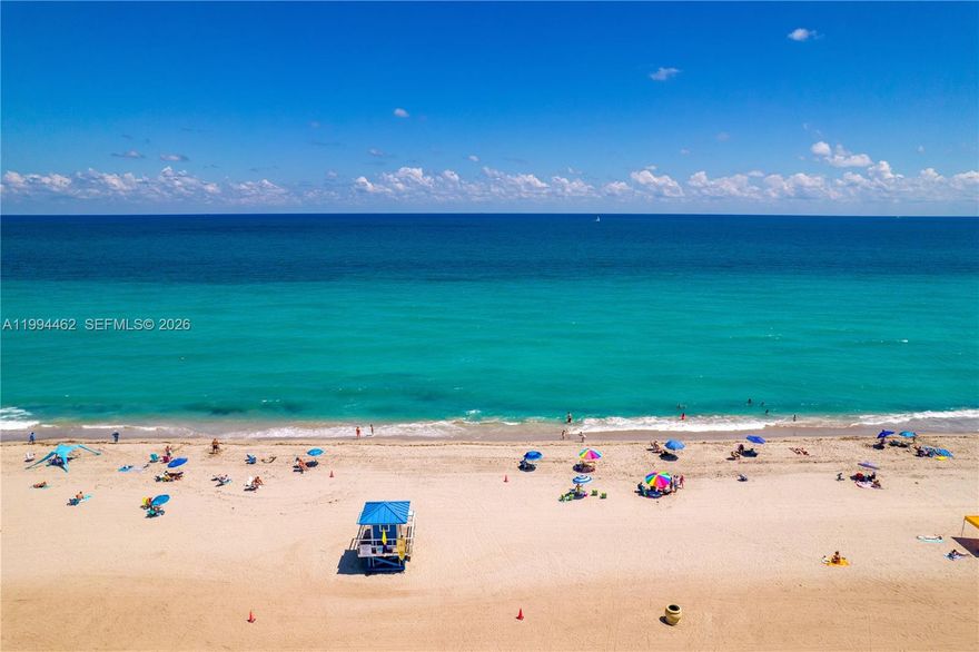 Live, Rent, or Both! — This rare offering in Hollywood Beach, where condos dominate, this unique townhome places you just moments from the shoreline with built-in income potential. Ideally located between the Hollywood Beach Boardwalk and the Intracoastal, you’ll enjoy walkable access to both. Set on a corner lot, the home spans three thoughtfully designed levels. Enter on the second floor to a bright, spacious foyer that opens to the main living area and a brand-new kitchen featuring waterfall quartz countertops, custom cabinetry, a large pantry, and eat-in counter. The third level includes a generous primary suite with a newly redesigned bath and two additional rooms and a bath, including a guest room with beautiful ocean views and a space currently styled as a custom wardrobe. Outdoors, enjoy a private patio with clean-lined pavers, white privacy fencing, an outdoor shower to rinse off after the beach, plenty of storage, and direct access to the newly paved Virginia Street leading to the boardwalk. With a separate-entry first level, the property offers flexible living and income-producing potential. Short-term rentals are permitted with restrictions, making this an ideal opportunity.