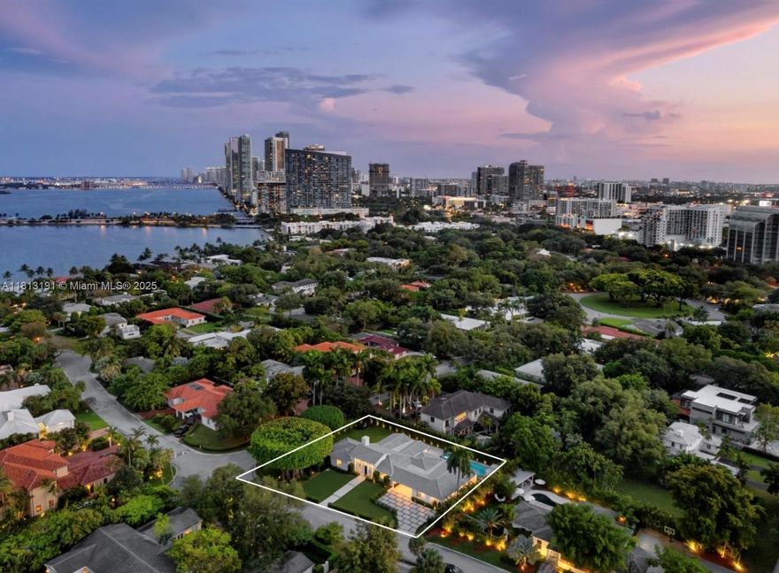 Welcome to Casa Garden, nestled on an oversized corner lot in the prestigious, gated Bay Point community. This fully renovated like brand new one-story home, offers unparalleled outdoor beauty and privacy. Its split floor plan features bright, open spaces, soaring ceilings, and a seamless flow connecting the living, family, and dining areas to serene garden views. The expansive enclosed Florida room, with its side-to-side sliding windows, brings the outdoors in, allowing you to fully appreciate the lush surroundings. Step outside to a true outdoor paradise: a breathtaking banyan tree, expansive green spaces, and a brand-new heated pool with a spa. Inside, the kitchen boasts top-of-the-line appliances, a gas range, and a cozy breakfast nook.